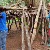 Children building a den during a forest school session